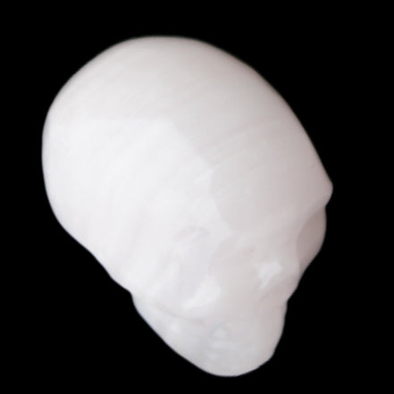Mangano Calcite skull 24*38*32mm 48g in sunlight - Rocks and Things Store