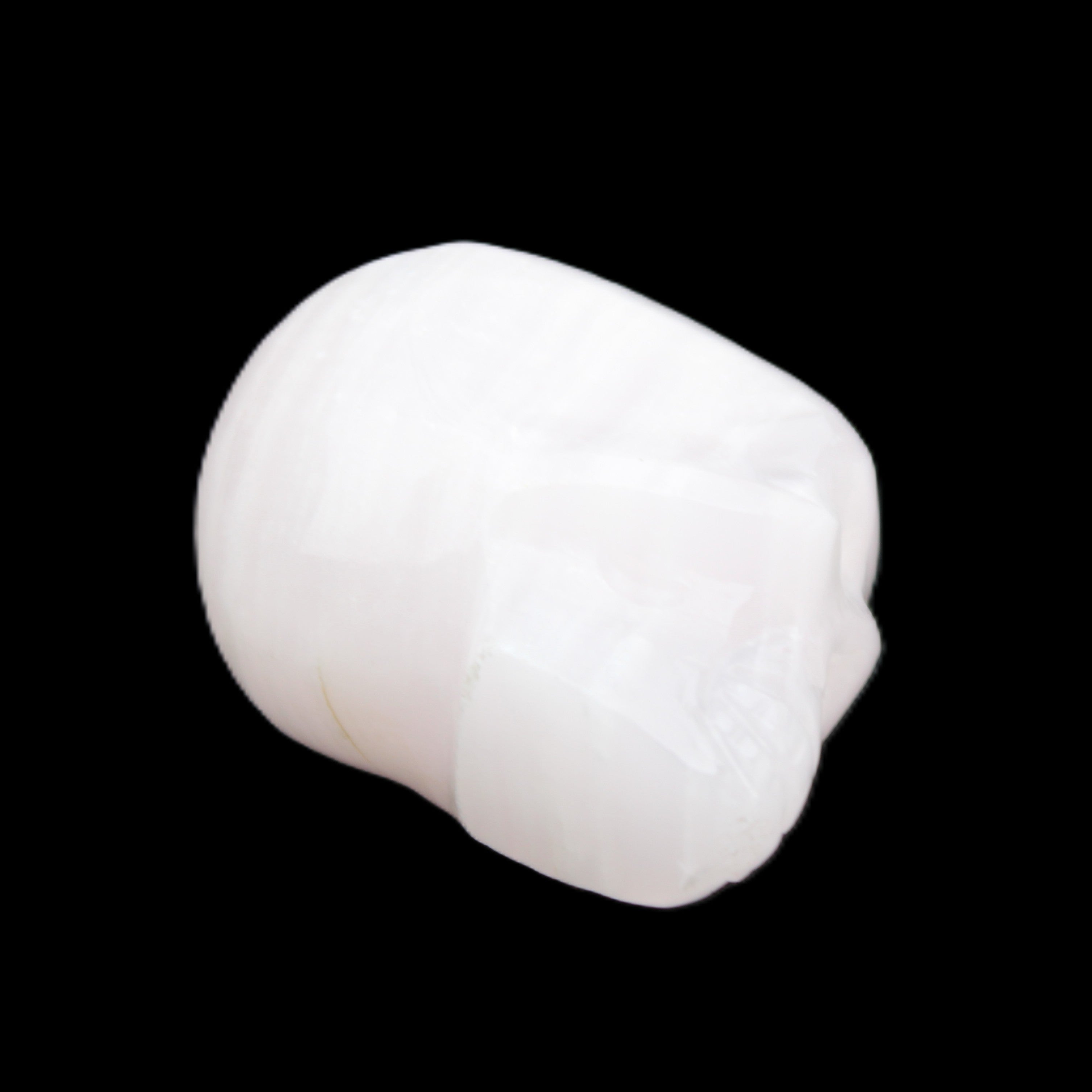 Mangano Calcite skull 24*38*32mm 48g in sunlight - Rocks and Things Store