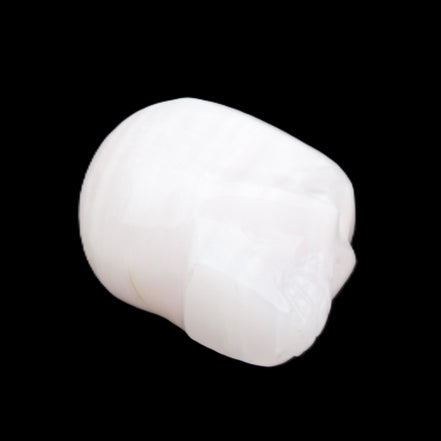 Mangano Calcite skull 24*38*32mm 48g in sunlight - Rocks and Things Store