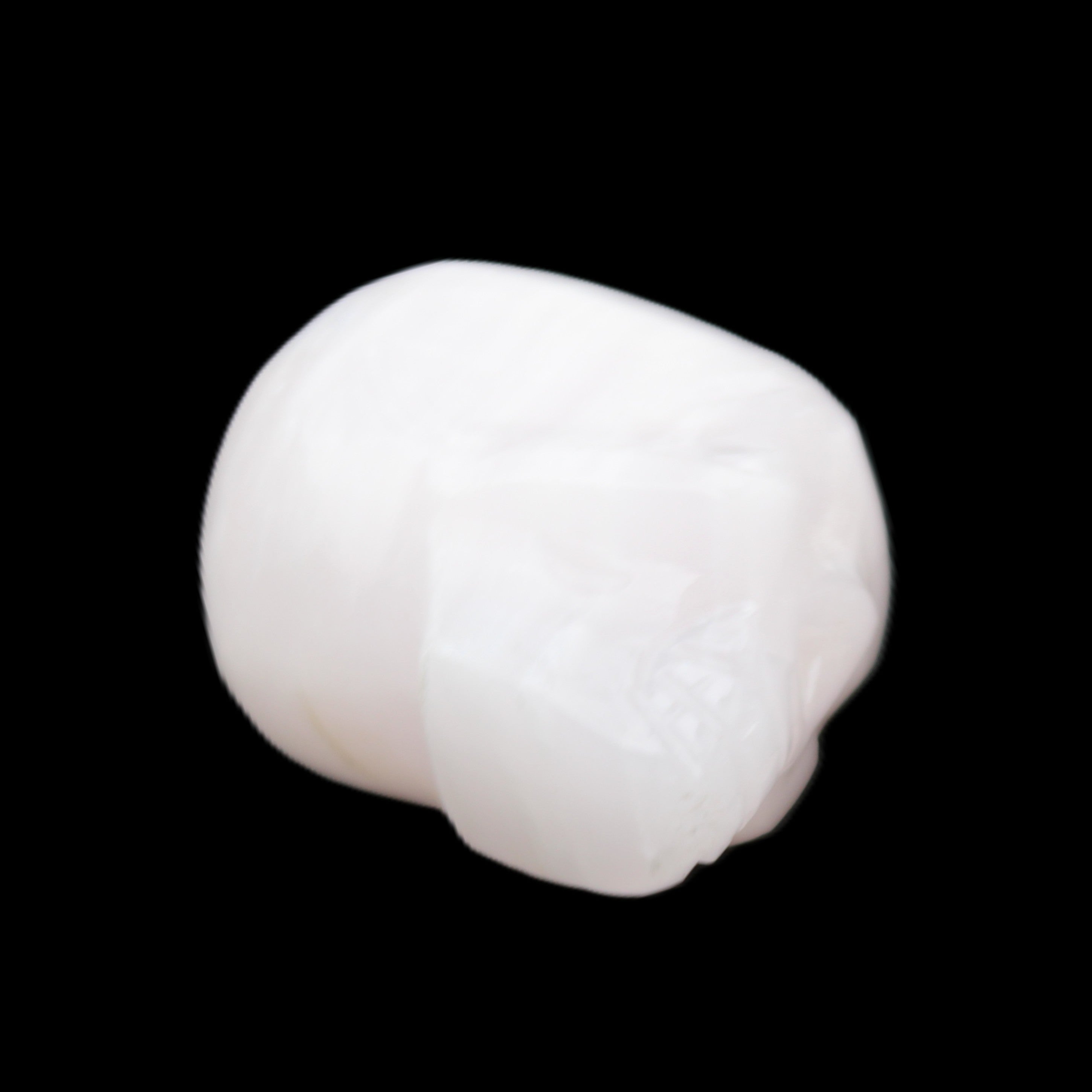 Mangano Calcite skull 24*38*32mm 48g in sunlight - Rocks and Things Store