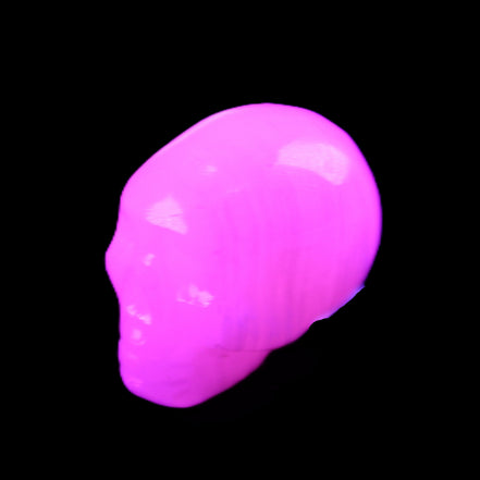 Mangano Calcite skull 24*38*32mm 48g in UV light - Rocks and Things Store