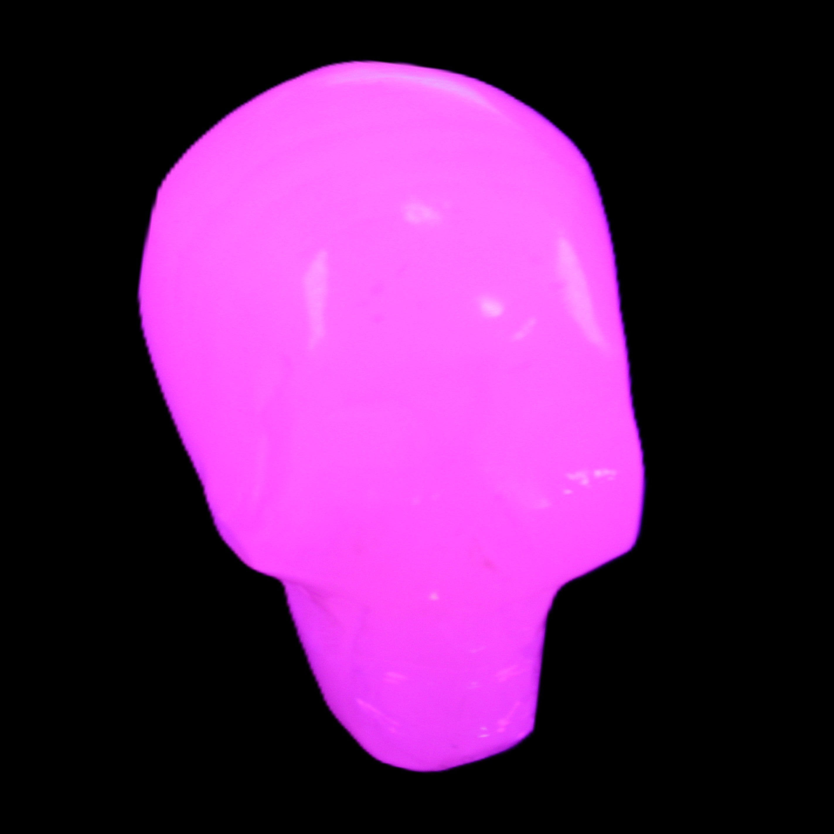 Mangano Calcite skull 24*38*32mm 48g in UV light - Rocks and Things Store
