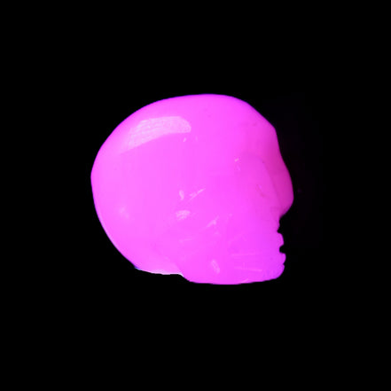 Mangano Calcite skull 24*38*32mm 48g in UV light - Rocks and Things Store