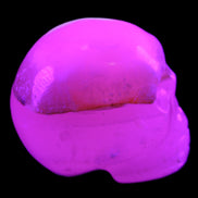 Mangano Calcite skull 38*55*48mm 167g in UV light - Rocks and Things Store
