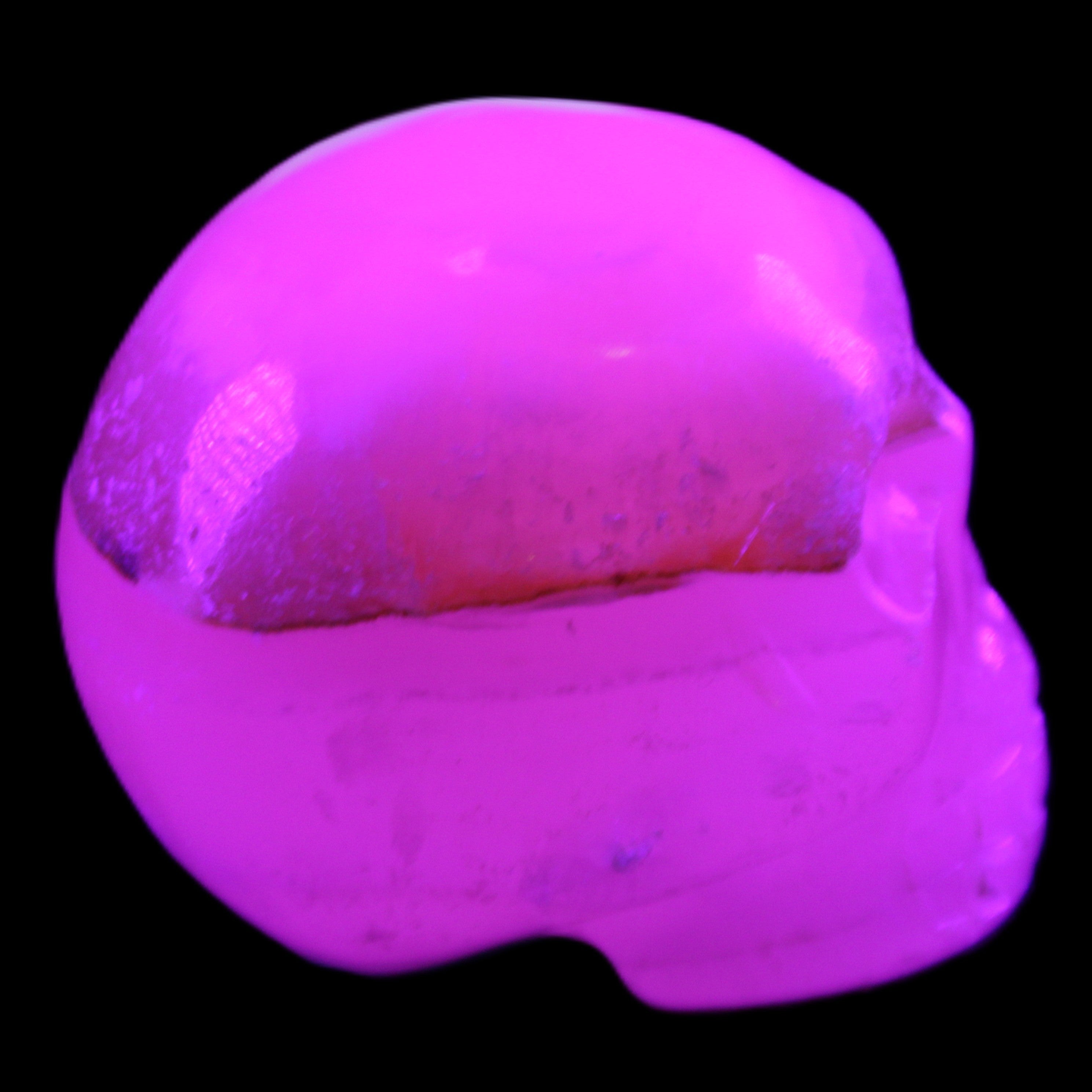Mangano Calcite skull 38*55*48mm 167g in UV light - Rocks and Things Store