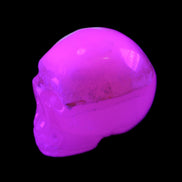 Mangano Calcite skull 38*55*48mm 167g in UV light - Rocks and Things Store