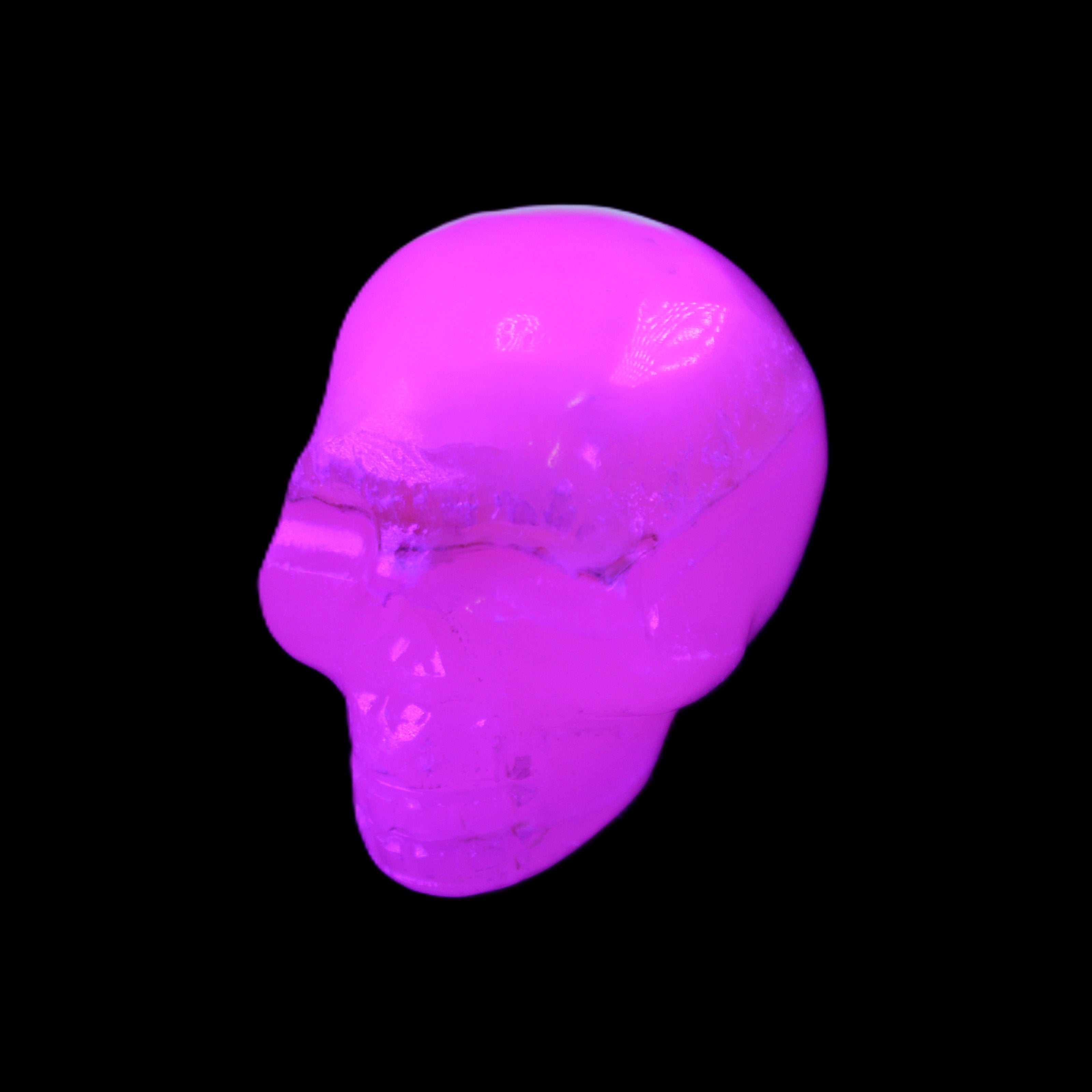 Mangano Calcite skull 38*55*48mm 167g in UV light - Rocks and Things Store