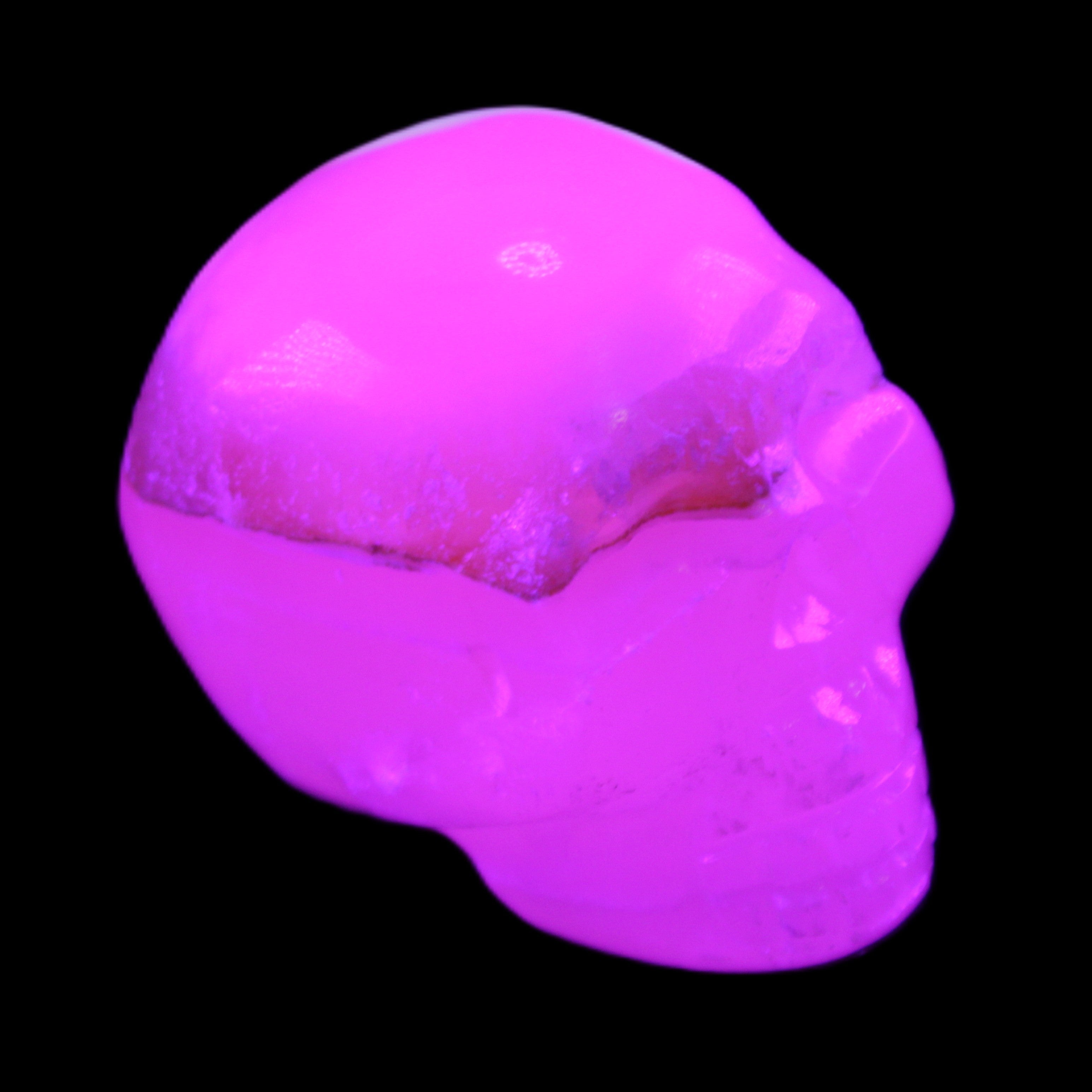 Mangano Calcite skull 38*55*48mm 167g in UV light - Rocks and Things Store