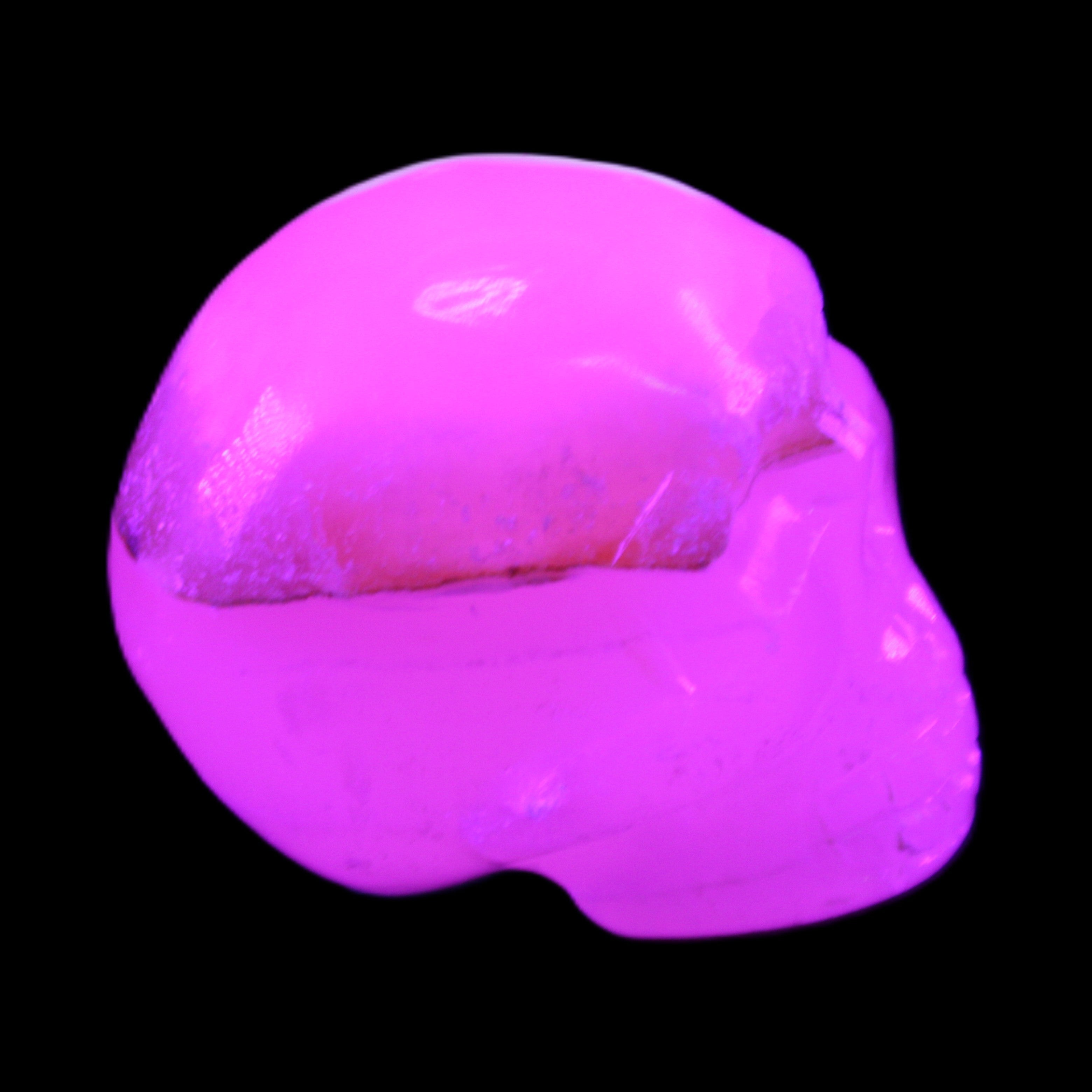 Mangano Calcite skull 38*55*48mm 167g in UV light - Rocks and Things Store