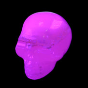 Mangano Calcite skull 38*55*48mm 167g in UV light - Rocks and Things Store