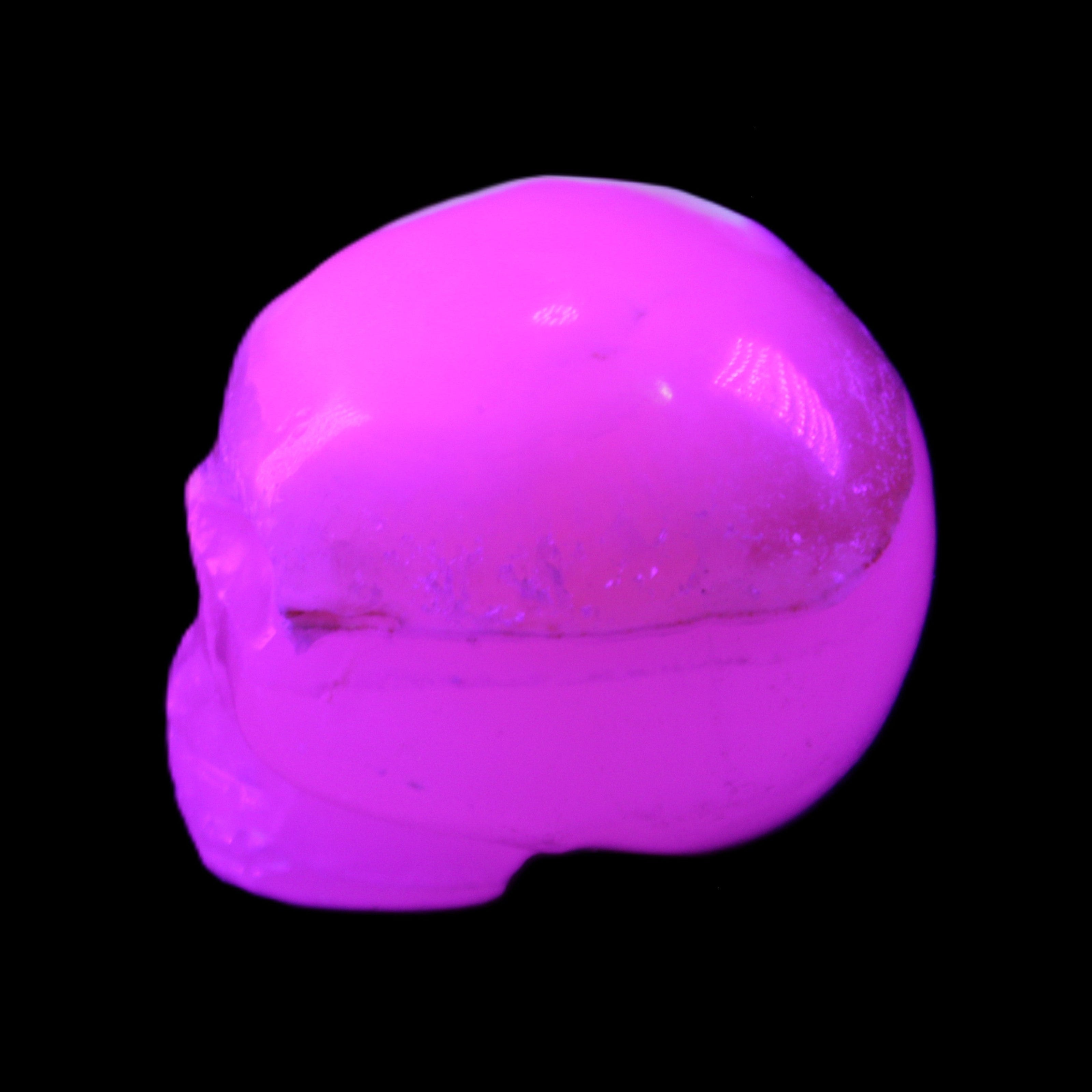 Mangano Calcite skull 38*55*48mm 167g in UV light - Rocks and Things Store