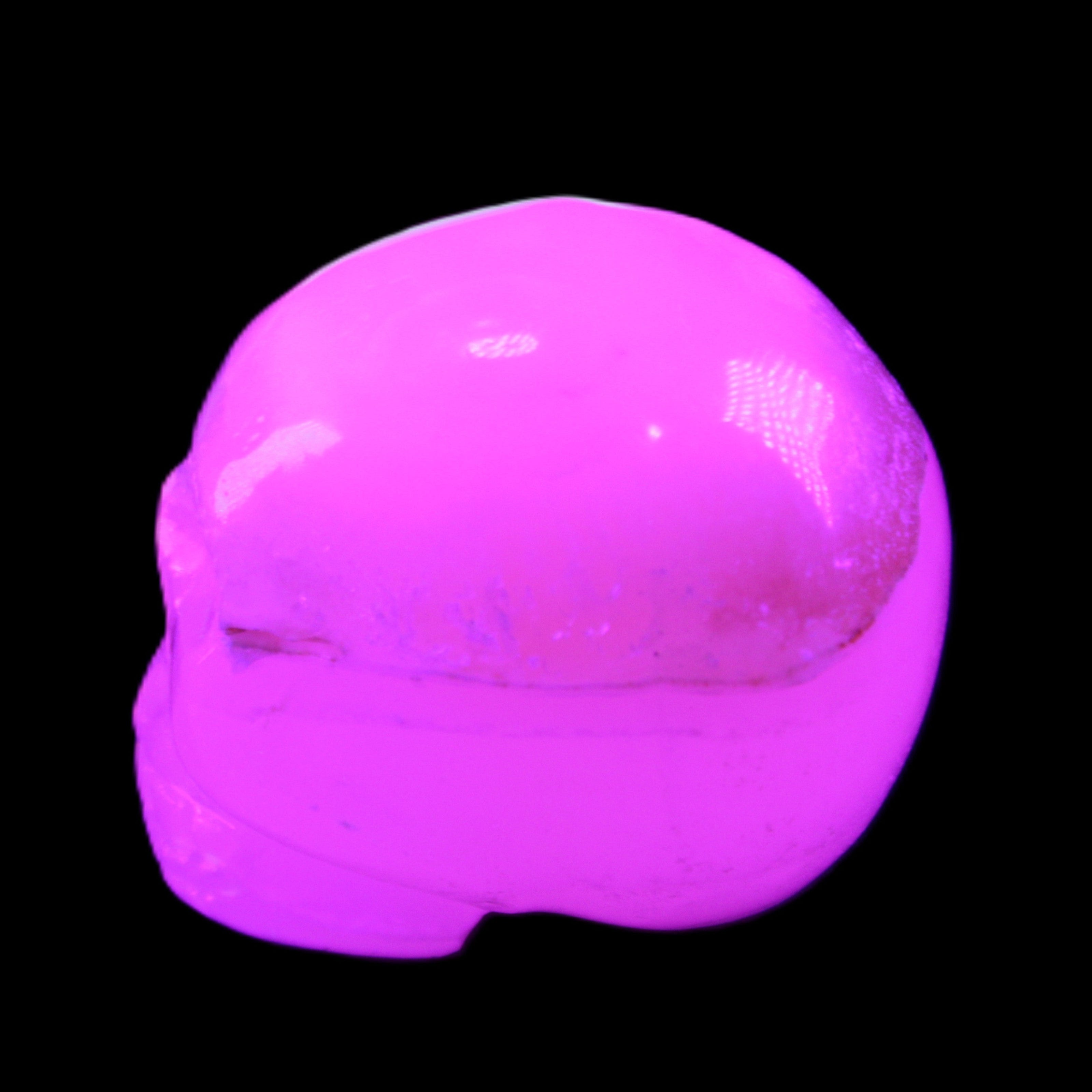 Mangano Calcite skull 38*55*48mm 167g in UV light - Rocks and Things Store