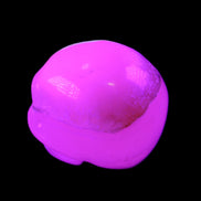 Mangano Calcite skull 38*55*48mm 167g in UV light - Rocks and Things Store
