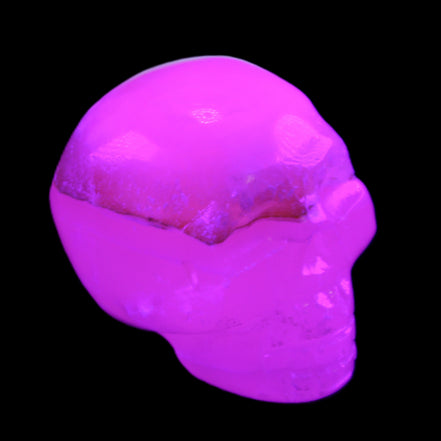 Mangano Calcite skull 38*55*48mm 167g in UV light - Rocks and Things Store