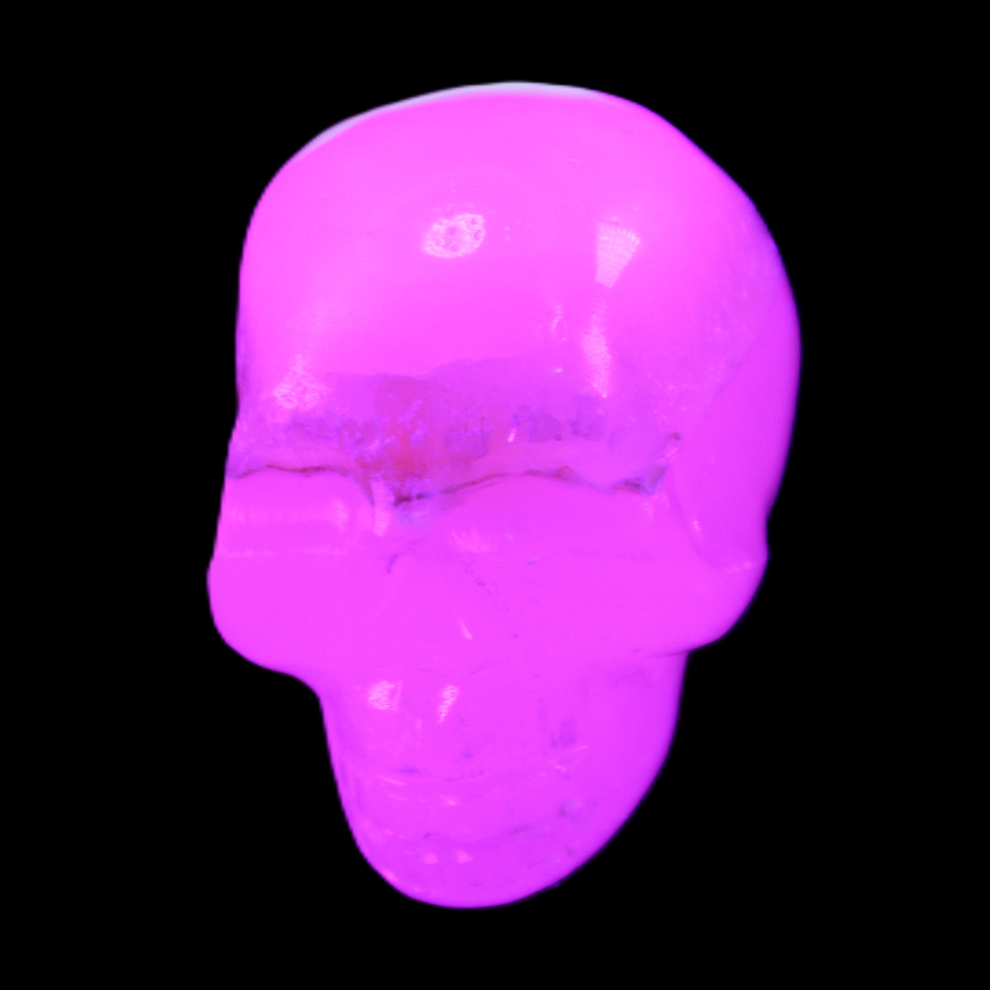 Mangano Calcite skull 38*55*48mm 167g in UV light - Rocks and Things Store