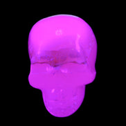 Mangano Calcite skull 38*55*48mm 167g in UV light - Rocks and Things Store