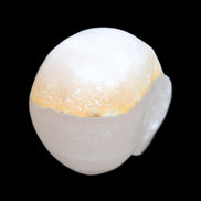 Mangano Calcite skull 38*55*48mm 167g in sunlight - Rocks and Things Store