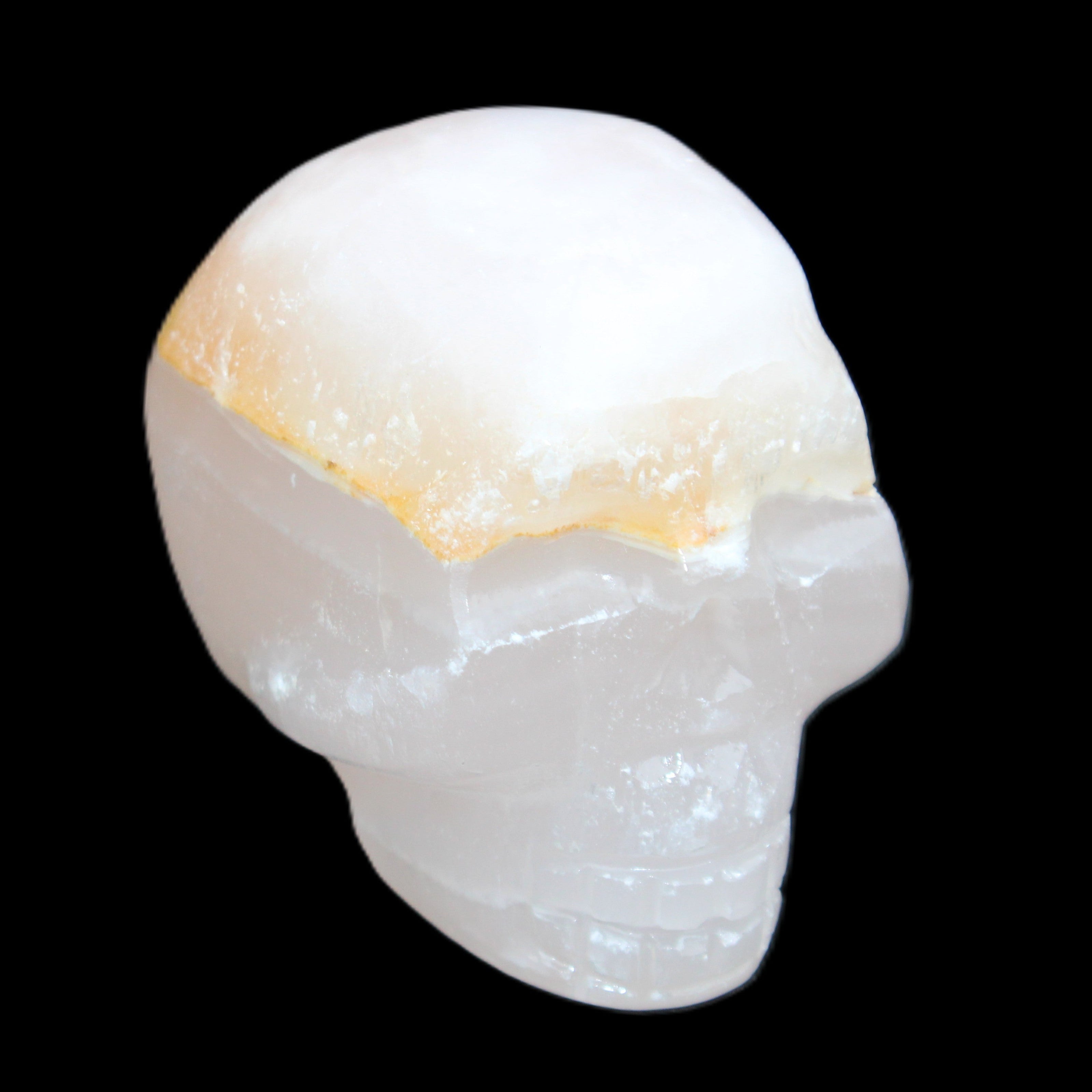 Mangano Calcite skull 38*55*48mm 167g in sunlight - Rocks and Things Store