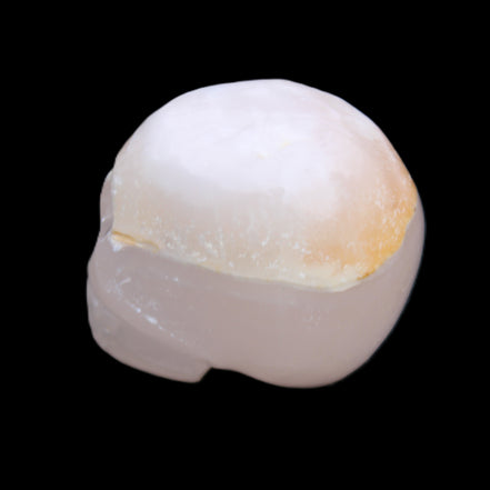 Mangano Calcite skull 38*55*48mm 167g in sunlight - Rocks and Things Store