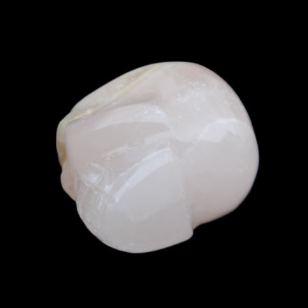Mangano Calcite skull 38*55*48mm 167g in sunlight - Rocks and Things Store