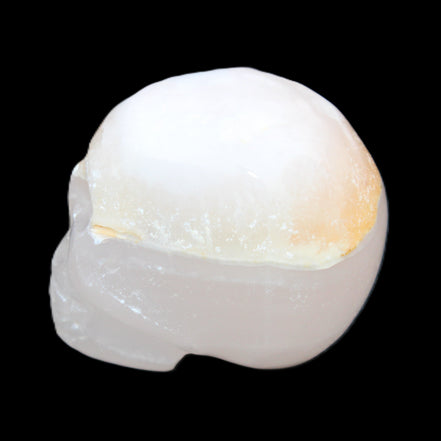 Mangano Calcite skull 38*55*48mm 167g in sunlight - Rocks and Things Store