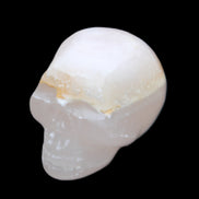 Mangano Calcite skull 38*55*48mm 167g in sunlight - Rocks and Things Store