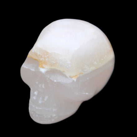 Mangano Calcite skull 38*55*48mm 167g in sunlight - Rocks and Things Store