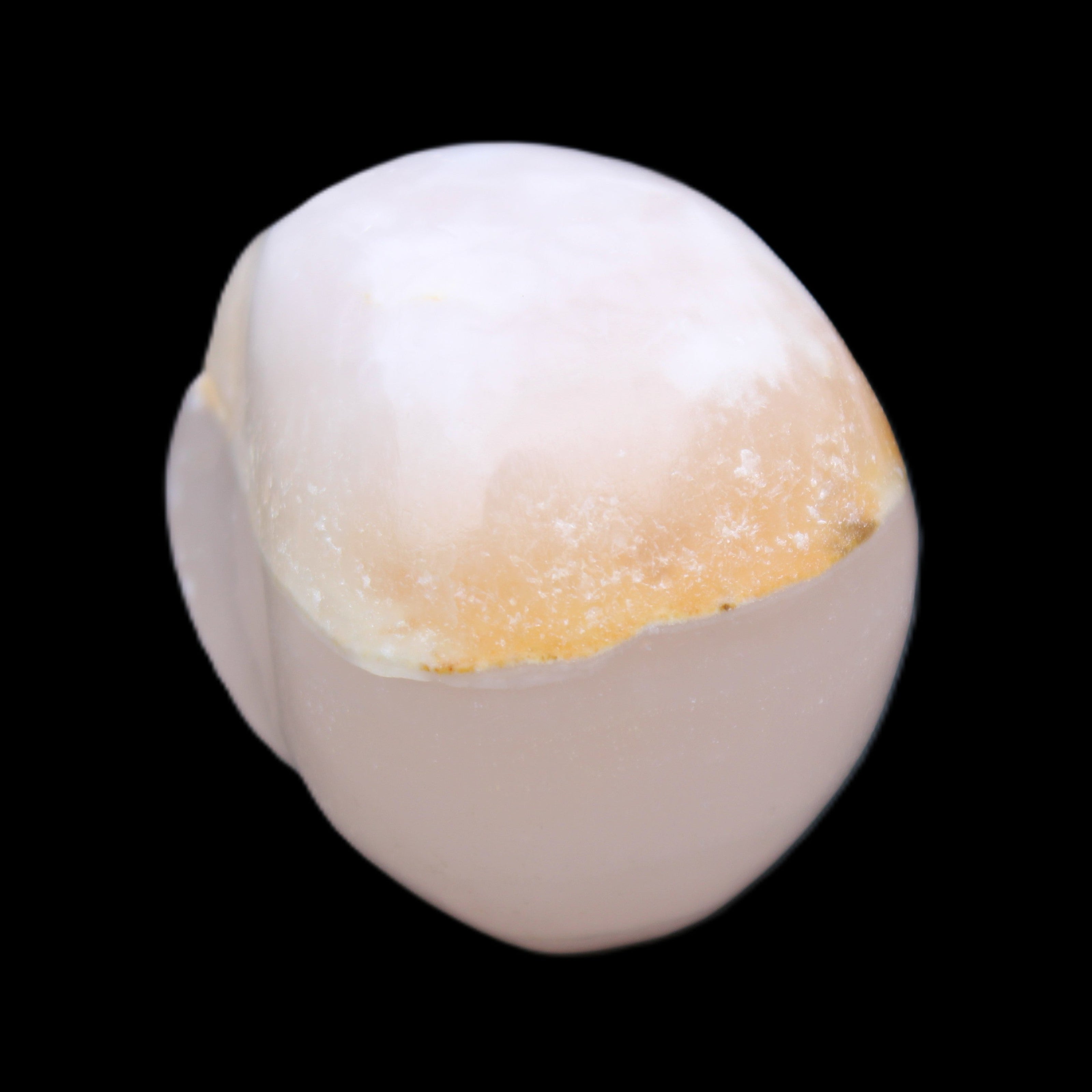 Mangano Calcite skull 38*55*48mm 167g in sunlight - Rocks and Things Store