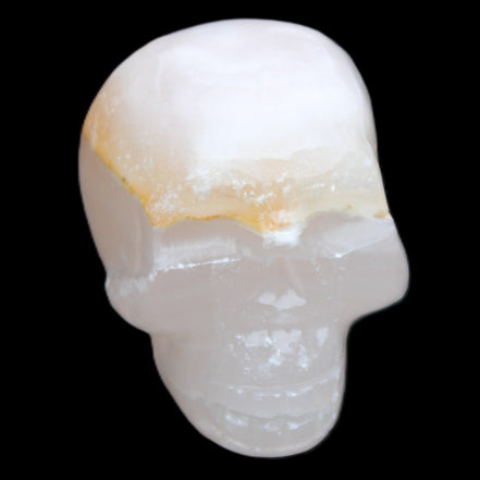 Mangano Calcite skull 38*55*48mm 167g in sunlight - Rocks and Things Store