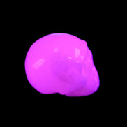 Mangano Calcite skull 32*45*38mm 87g in UV light - Rocks and Things Store