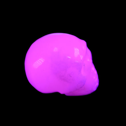 Mangano Calcite skull 32*45*38mm 87g in UV light - Rocks and Things Store