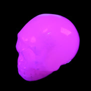 Mangano Calcite skull 32*45*38mm 87g in UV light - Rocks and Things Store