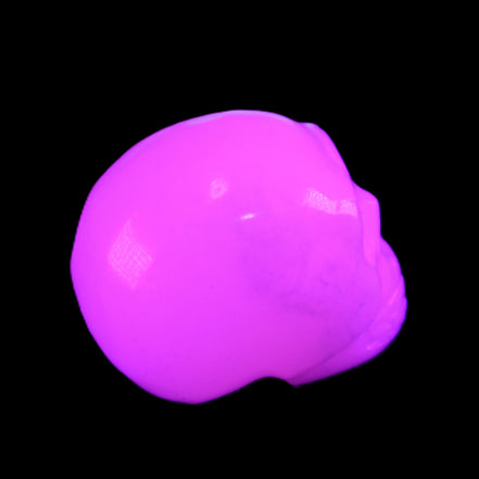 Mangano Calcite skull 32*45*38mm 87g in UV light - Rocks and Things Store