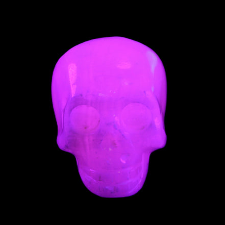Mangano Calcite skull 32*45*38mm 87g in UV light - Rocks and Things Store
