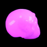 Mangano Calcite skull 32*45*38mm 87g in UV light - Rocks and Things Store