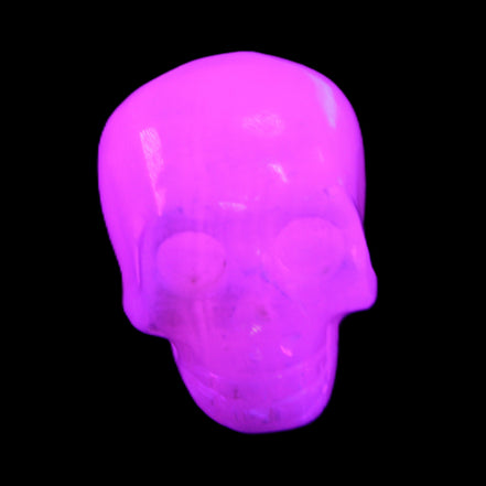 Mangano Calcite skull 32*45*38mm 87g in UV light - Rocks and Things Store