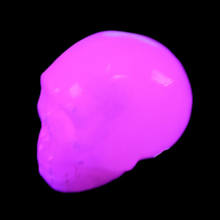 Mangano Calcite skull 32*45*38mm 87g in UV light - Rocks and Things Store