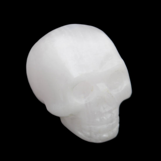 Mangano Calcite skull 32*45*38mm 87g in sunlight - Rocks and Things Store