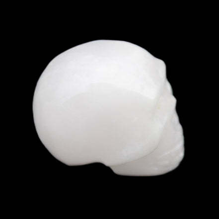 Mangano Calcite skull 32*45*38mm 87g in sunlight - Rocks and Things Store