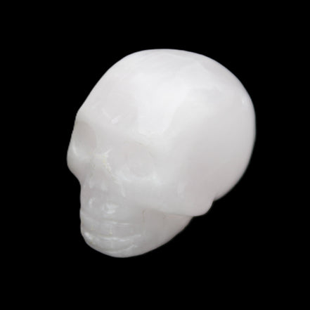Mangano Calcite skull 32*45*38mm 87g in sunlight - Rocks and Things Store