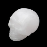 Mangano Calcite skull 32*45*38mm 87g in sunlight - Rocks and Things Store