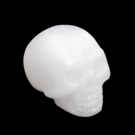 Mangano Calcite skull 32*45*38mm 87g in sunlight - Rocks and Things Store