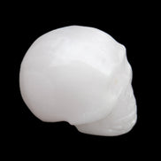 Mangano Calcite skull 32*45*38mm 87g in sunlight - Rocks and Things Store
