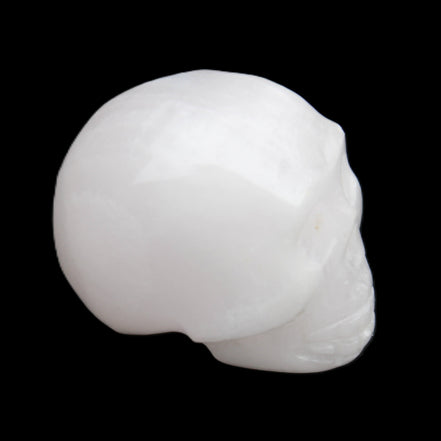 Mangano Calcite skull 32*45*38mm 87g in sunlight - Rocks and Things Store