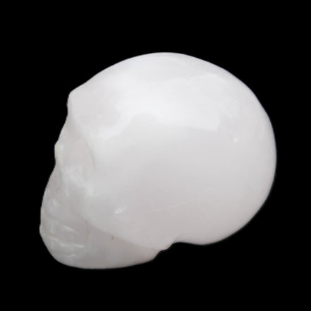 Mangano Calcite skull 32*45*38mm 87g in sunlight - Rocks and Things Store