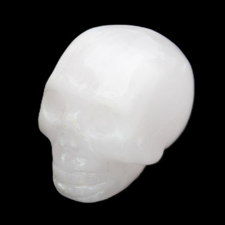 Mangano Calcite skull 32*45*38mm 87g in sunlight - Rocks and Things Store