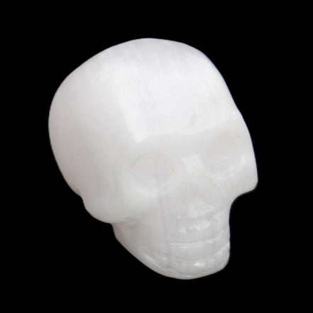 Mangano Calcite skull 32*45*38mm 87g in sunlight - Rocks and Things Store