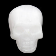 Mangano Calcite skull 32*45*38mm 87g in sunlight - Rocks and Things Store
