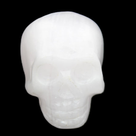 Mangano Calcite skull 32*45*38mm 87g in sunlight - Rocks and Things Store