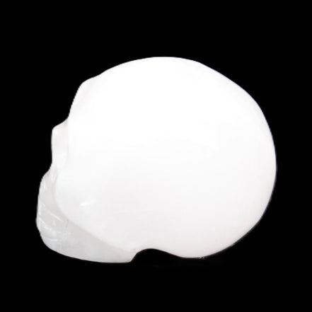 Mangano Calcite skull 32*45*38mm 87g in sunlight - Rocks and Things Store